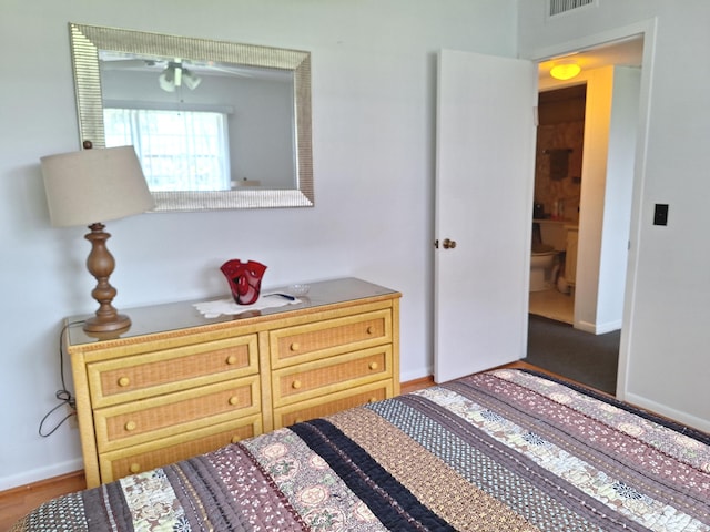 bedroom with hardwood / wood-style flooring