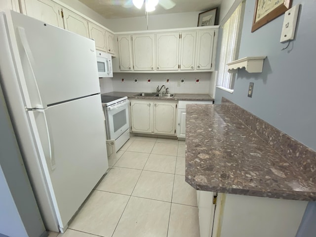 kitchen featuring light tile patterned floors, white appliances, ceiling fan, and sink