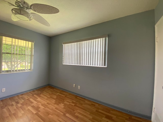 empty room featuring light hardwood / wood-style flooring and ceiling fan