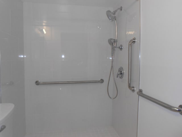 bathroom with a tile shower