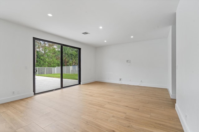 unfurnished room with light hardwood / wood-style floors