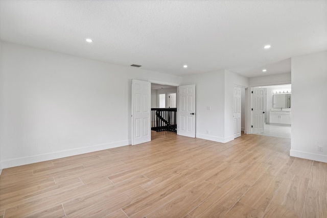 unfurnished room featuring light hardwood / wood-style floors