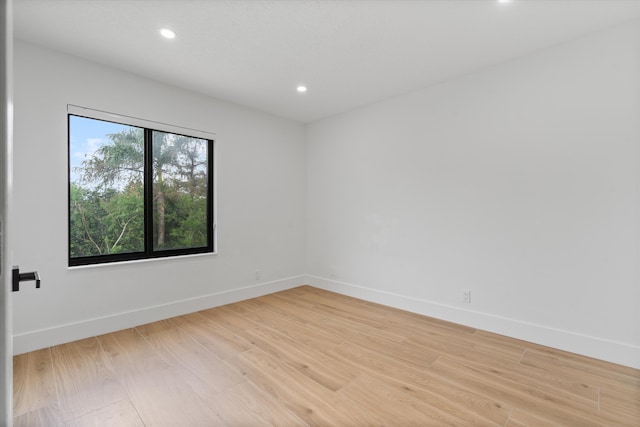 spare room with light hardwood / wood-style flooring