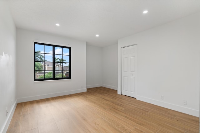 unfurnished room featuring light wood-type flooring