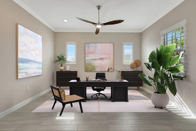 home office with ornamental molding, light wood-type flooring, and ceiling fan