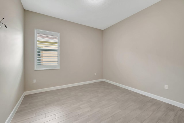 spare room featuring light hardwood / wood-style floors