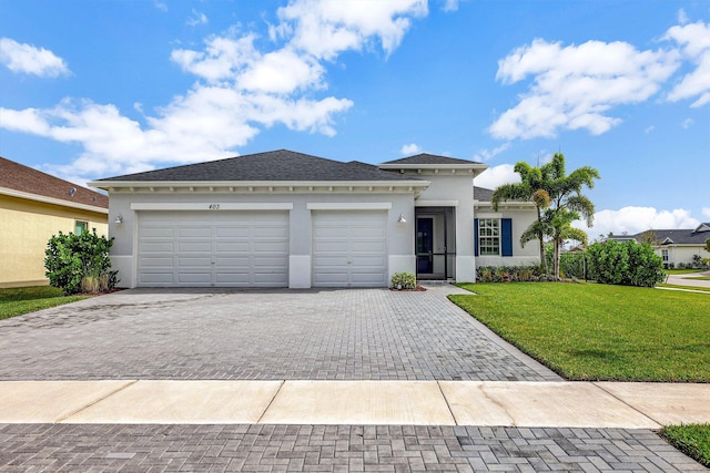 view of front facade with a garage and a front yard