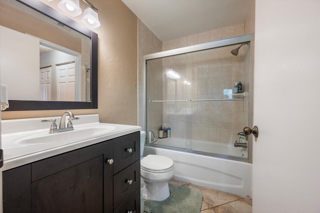 full bathroom with enclosed tub / shower combo, toilet, tile patterned flooring, and vanity