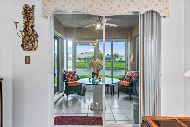 sunroom featuring ceiling fan