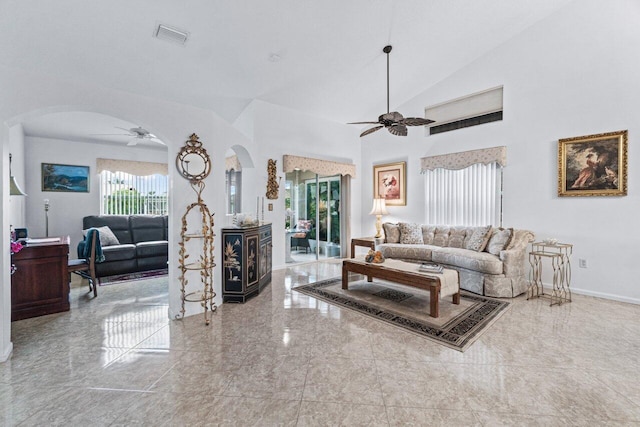 living room featuring ceiling fan and lofted ceiling