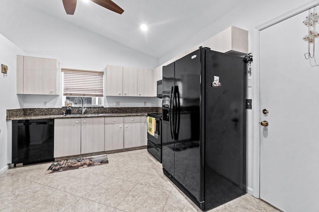 kitchen featuring black appliances, sink, vaulted ceiling, dark stone countertops, and ceiling fan