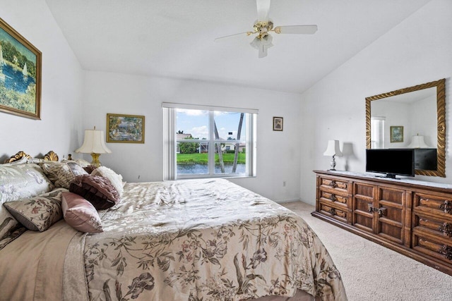 carpeted bedroom featuring vaulted ceiling and ceiling fan