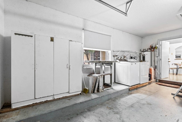 garage with washer and clothes dryer