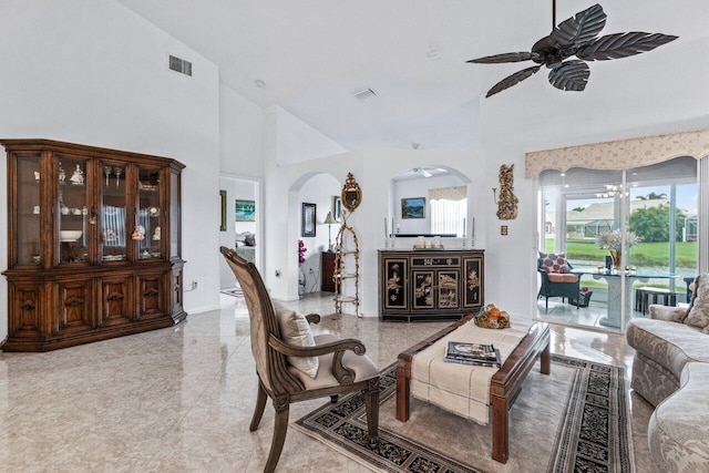 living room with high vaulted ceiling and ceiling fan