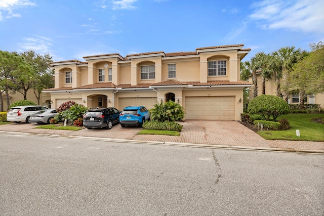 mediterranean / spanish house featuring a garage