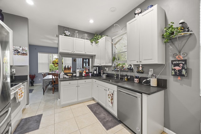 kitchen featuring white cabinetry, sink, and appliances with stainless steel finishes