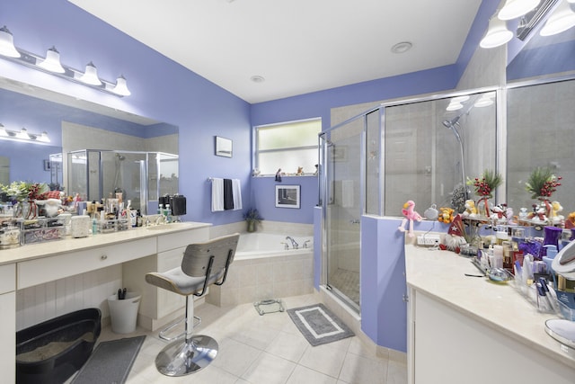 bathroom featuring vanity, tile patterned floors, and separate shower and tub