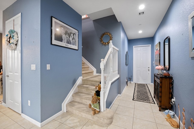 entrance foyer featuring light tile patterned flooring