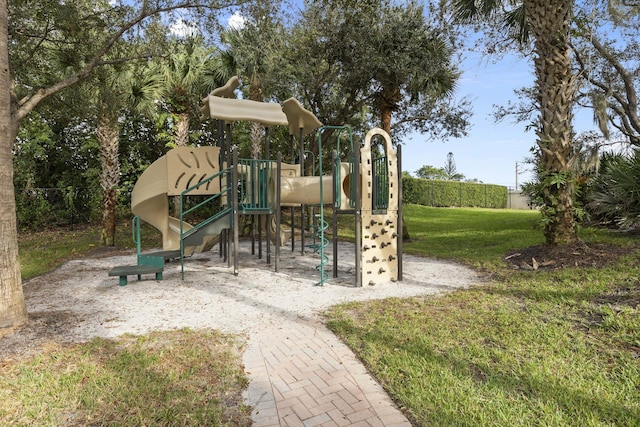 view of jungle gym with a lawn