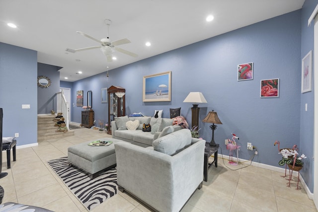 tiled living room with ceiling fan