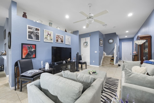 living room featuring ceiling fan and light tile patterned floors