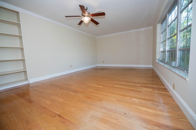 unfurnished room with crown molding, ceiling fan, and light wood-type flooring