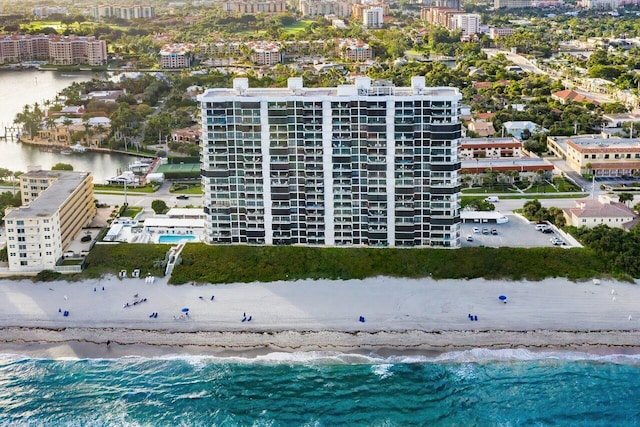 bird's eye view featuring a water view and a view of the beach