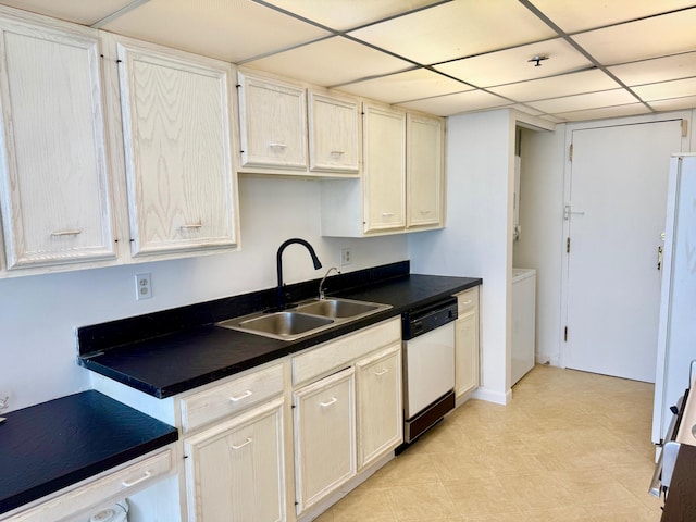 kitchen with a paneled ceiling, dishwasher, and sink