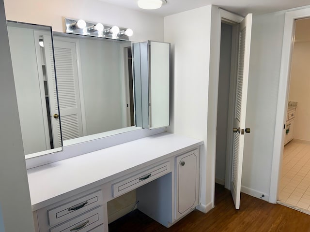 bathroom featuring vanity and wood-type flooring