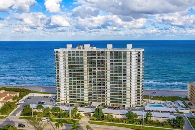 bird's eye view with a beach view and a water view