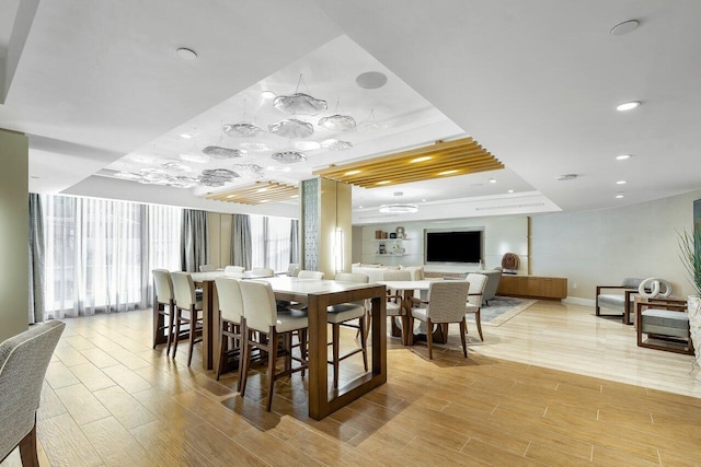 dining space with a tray ceiling