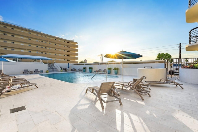 view of swimming pool with a patio