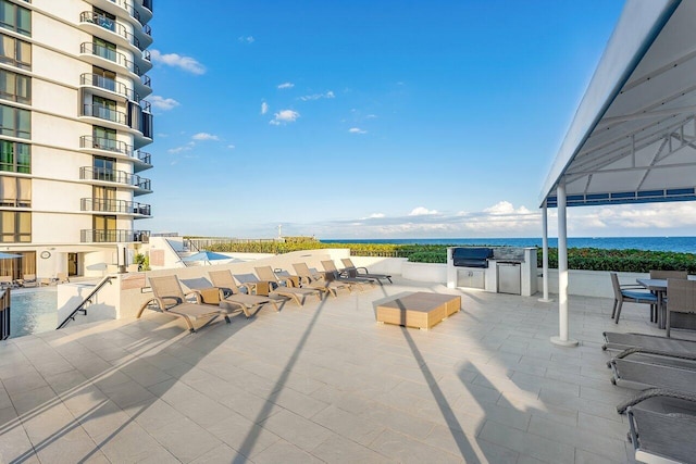 view of patio featuring a water view