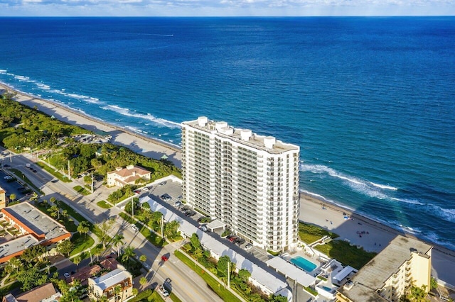 drone / aerial view with a view of the beach and a water view