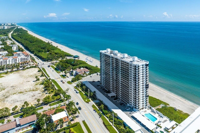 aerial view with a water view and a view of the beach