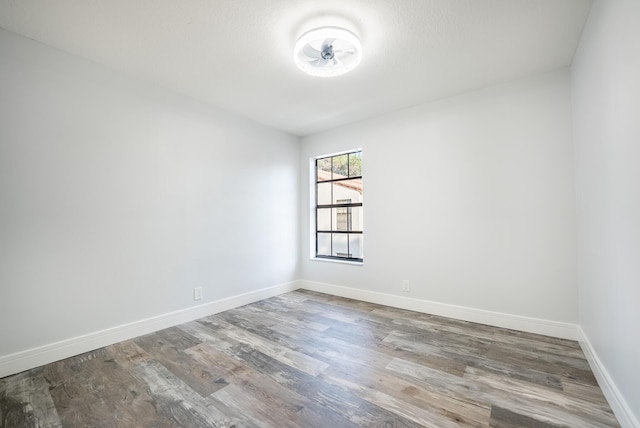 empty room featuring wood-type flooring