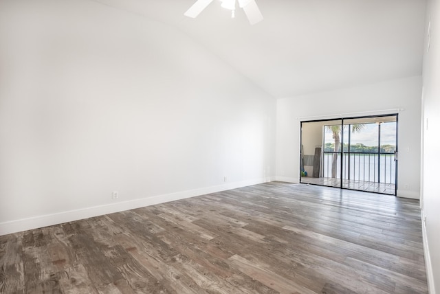 spare room with ceiling fan, wood-type flooring, and lofted ceiling