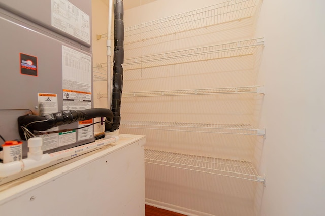 laundry area featuring hardwood / wood-style flooring