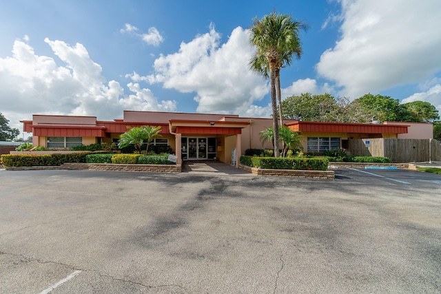 14 Lake Vista Trl Unit 104, Port Saint Lucie, FL 34952 - view of property featuring uncovered parking and fence