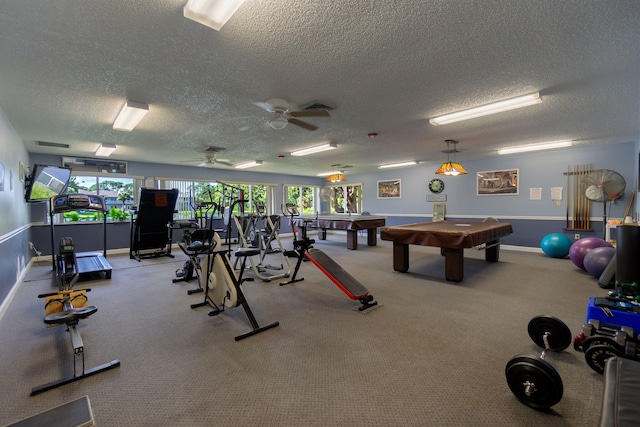 gym with carpet, a textured ceiling, ceiling fan, and billiards