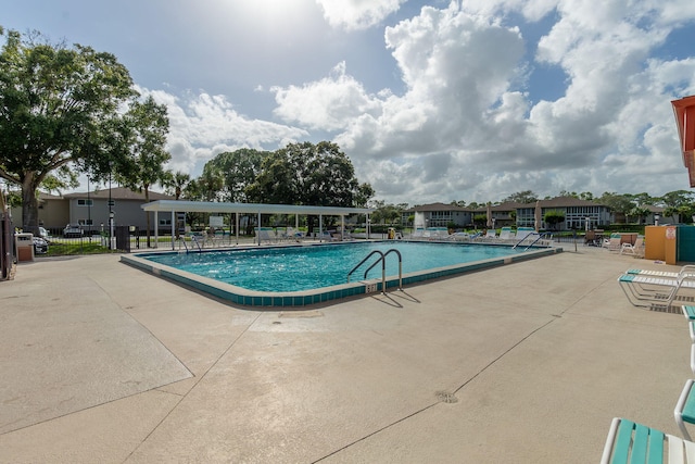 14 Lake Vista Trl Unit 104, Port Saint Lucie, FL 34952 - community pool with a patio and fence