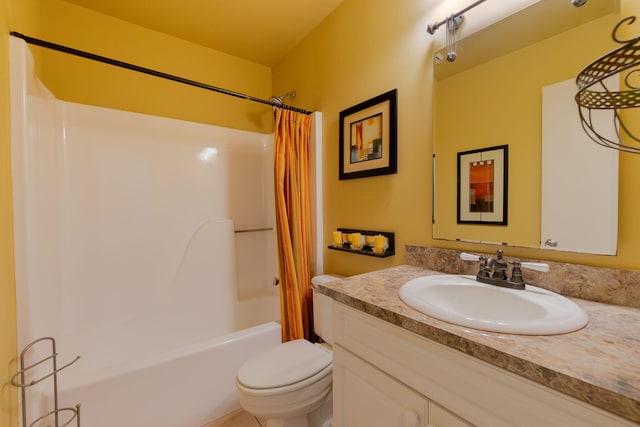 full bathroom with toilet, vanity, and shower / bath combo with shower curtain