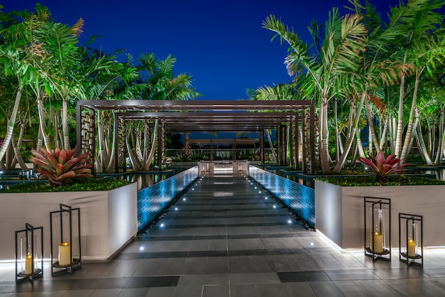 patio at twilight with a pergola