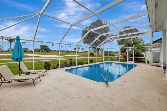 view of swimming pool with a lawn, a lanai, and a patio