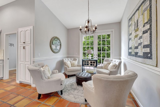 tiled living room featuring french doors, vaulted ceiling, and an inviting chandelier