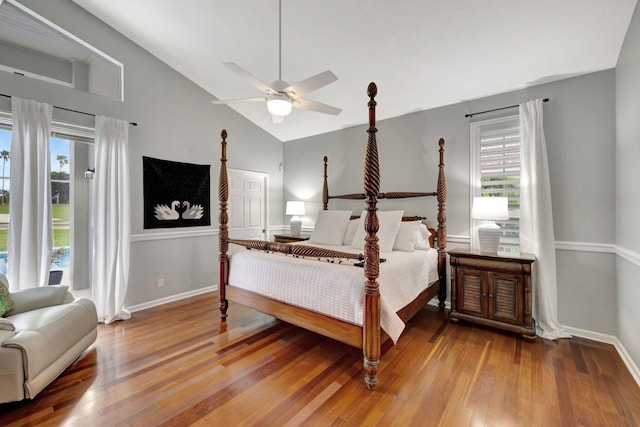 bedroom with ceiling fan, high vaulted ceiling, and light hardwood / wood-style flooring