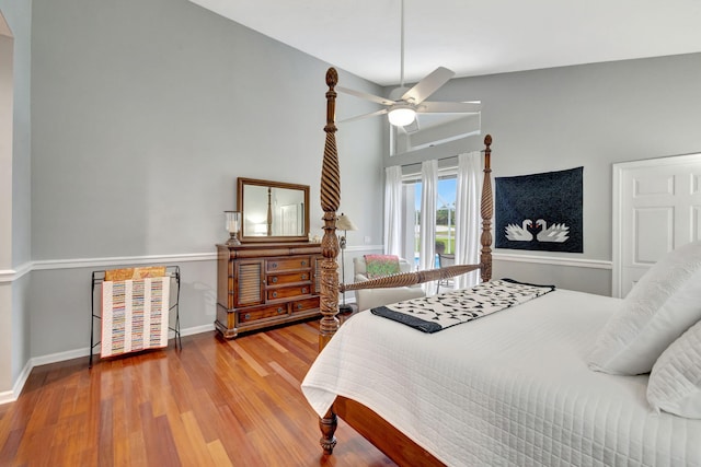 bedroom with hardwood / wood-style floors and ceiling fan