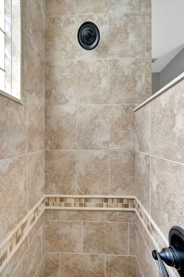 details with a tile shower