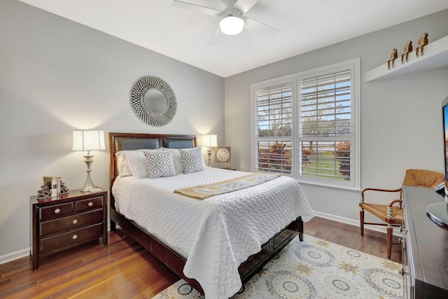 bedroom with hardwood / wood-style floors and ceiling fan