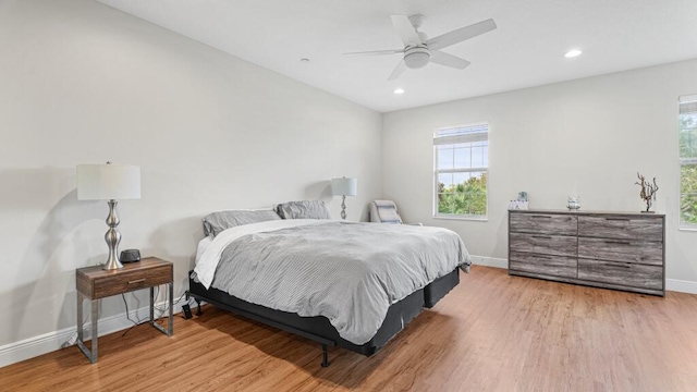 bedroom featuring light hardwood / wood-style flooring and ceiling fan